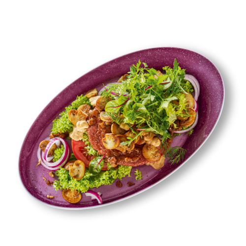 Burger Brotlos mit Patty, Salat und Zwiebel auf einem Teller – klassisch serviert bei Hans im Glück.